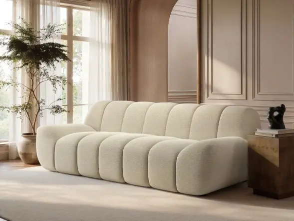 Macy large 3 seater sofa in cream textured fabric with sculpted panel design in a modern living room
