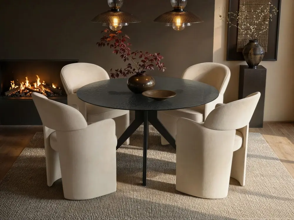 Emil round black mottled glass dining table with four beige Estella chairs 
