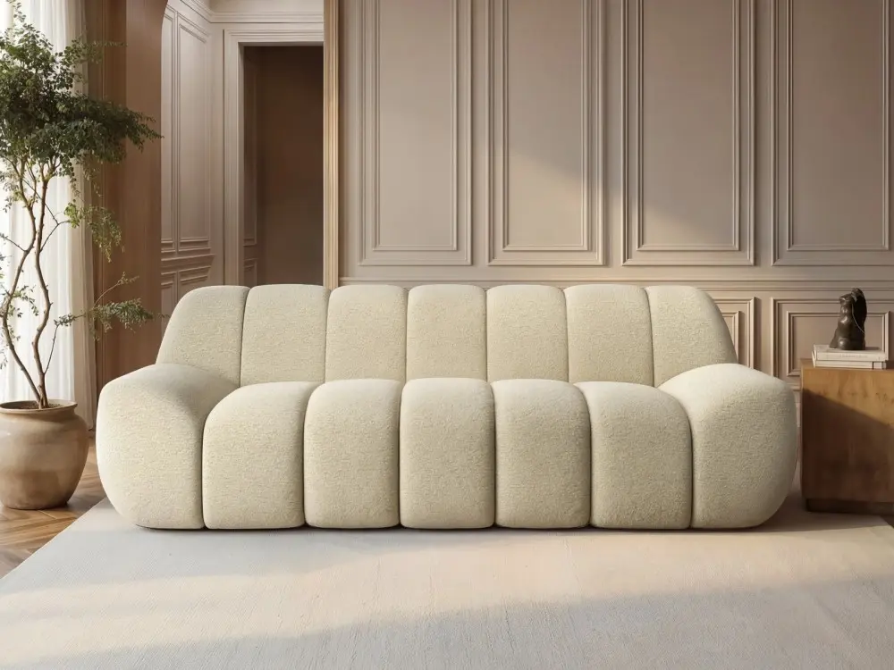 Macy large 3 seater sofa in cream textured fabric with sculpted panel design in a modern living room
