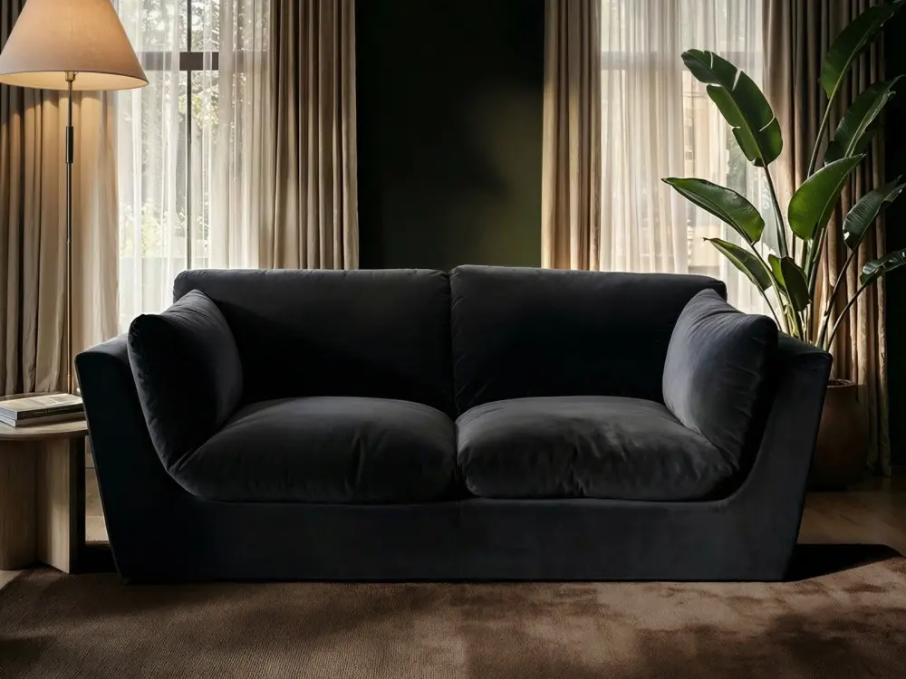3 seater black velvet sofa with minimalist design and deep cushioned seating
