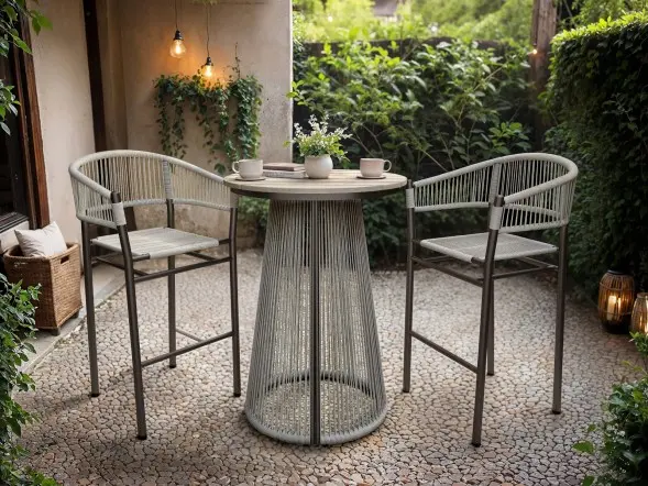 Outdoor bar table and two bar chairs with woven rope detailing on a patio
