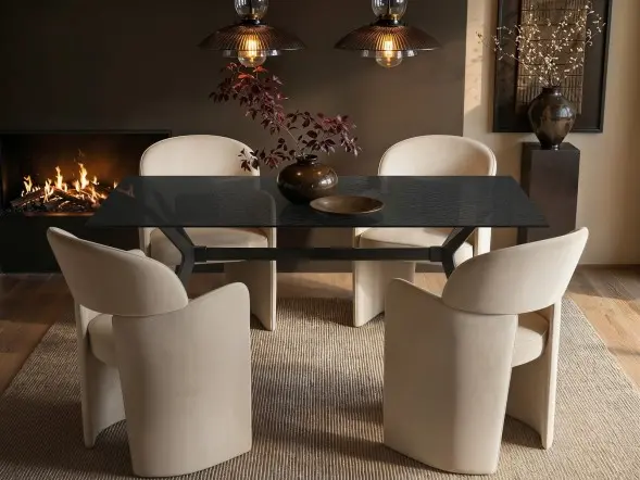 Emil rectangular black mottled glass dining table with four beige Estella velvet chairs 
