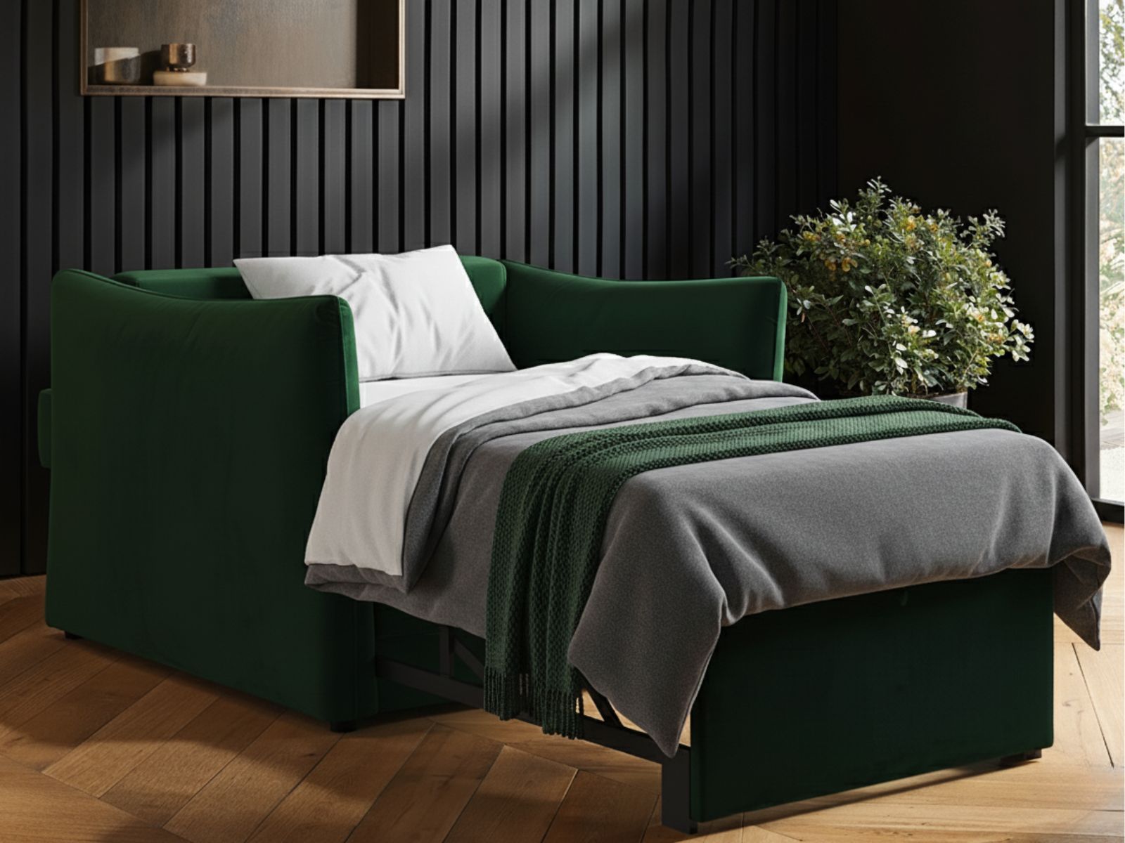 green sofa bed unfolded in living area